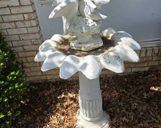 Concrete bird bath and dove statue. 