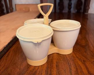 	#66		4 piece Tupperware lot including condiment/candy set, vegetable steamer, tall cake carrier with handle and extra plates, and lunch box set	 $ 25.00 																							