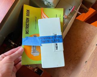 	#33		New Home sewing machine in table with attachments and manual (untested, 22–44 x 17.5 x 31)	 $ 75.00 																							