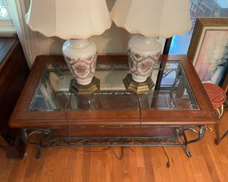	#15		Glass-top coffee table with faux leather insert and pewter grapevine base (48 x 26.5 x 19)	 $ 80.00 																							