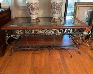 	#15		Glass-top coffee table with faux leather insert and pewter grapevine base (48 x 26.5 x 19)	 $ 80.00 																							