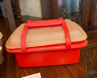 	#66		4 piece Tupperware lot including condiment/candy set, vegetable steamer, tall cake carrier with handle and extra plates, and lunch box set	 $ 25.00 																							