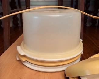 	#66		4 piece Tupperware lot including condiment/candy set, vegetable steamer, tall cake carrier with handle and extra plates, and lunch box set	 $ 25.00 																							