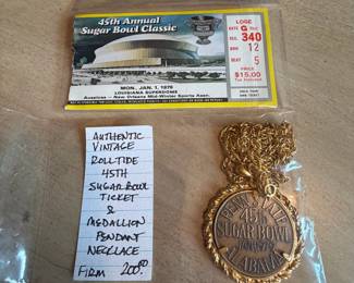 	#67	KW	Authentic vintage Alabama “Roll Tide” 45th Sugar Bowl ticket with medallion pendant necklace	 $ 200.00 																							