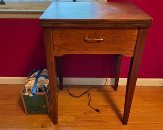 	#33		New Home sewing machine in table with attachments and manual (untested, 22–44 x 17.5 x 31)	 $ 75.00 																							