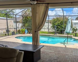 Seamless Indoor-Outdoor Living in this Beautiful Port Charlotte Estate that is FOR SALE and a Fire Pit!