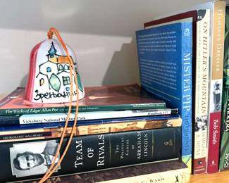 Coffee table: atlas, travel Non-fiction:  nature, New Mexico, Madeline Albright,  Lincoln, Webster's New International Dictionary, second edition, 1950  Fiction: Frank McCourt, Shakespeare, Marquez, Star Wars 