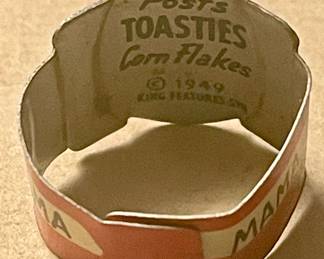 **RARE   MID-CENTURY 1949 POST'S TOASTIES CORN FLAKES TIN GUMBALL MACHINE RING - MAMA BUMSTED