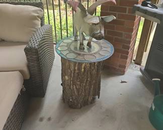 Whimsical Flying Pig Sculpture on Mosaic Log Table