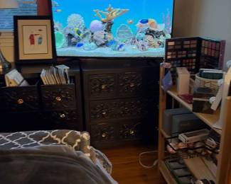 Black dressers with pink knobs