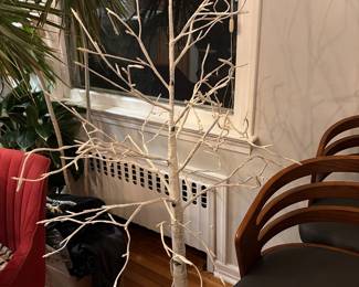White decorative tree with light in the branches 