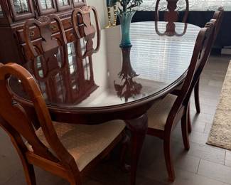 beautiful dining table with six chairs, includes 1 captain's chair