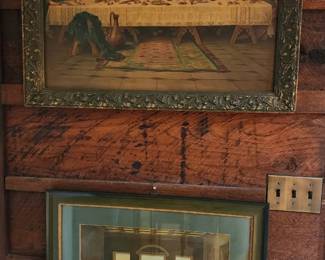 two framed reproductions of The Last Supper, one in a dark ornate frame above a smaller, simpler frame