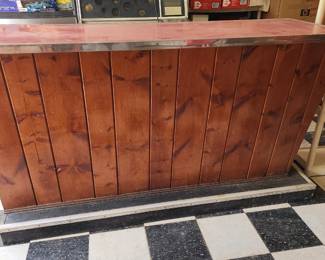  Rustic wooden bar with a red countertop