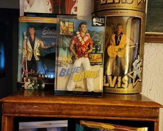 Elvis Presley-themed Barbie dolls, including figures from "Elvis Never Set a Album," "Blue Hawaii," and "Live on Stage