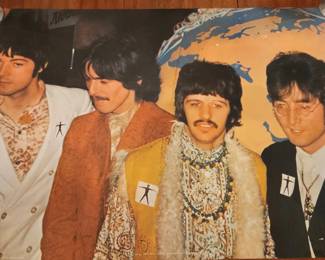 This vintage poster features The Beatles in a 1970 promotional image for the "Pace International" campaign, showing the band members in coordinated outfits with the iconic walking figure emblem. The poster was created by David Redfern and is considered a collectible piece of 1970s British pop culture memorabilia