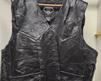 Vintage black leather motorcycle biker vest with a patchwork design