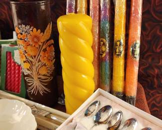Decorative candles, including a large yellow twisted pillar candle