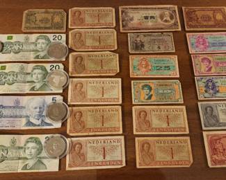Vintage banknotes from various countries, including Canada, Netherlands, Timor, and Portugal
