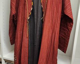 Vintage red robe with vertical stripes and intricate embroidered trim along the edges