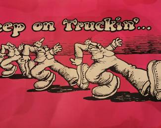 This vintage poster features Robert Crumb’s iconic “Keep on Truckin’” artwork, depicting a row of cartoonish men strutting across a red background. First published in the 1960s
