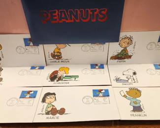 Peanuts First Day Cover (FDC) envelopes featuring characters such as Charlie Brown, Snoopy, and Lucy