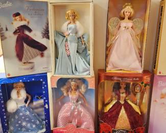 Holiday Barbie dolls in their original packaging
