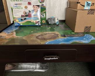 kids train table with lots of accessories