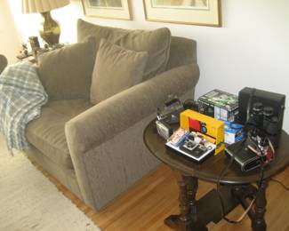 Room and Board oversized upholstered chair, plaid Columbia throw, dropleaf side table, cameras