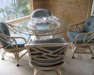 Rattan glass top table and 4 swivel chairs
