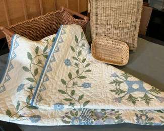 Lot 62: Hand  Stitched Embroidered Quilt,  Two Wicker Baskets .