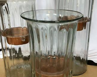 Lot 17: Three Tall Glass With Copper Candle Holders