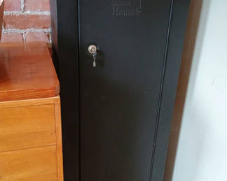 Lot 159: Homak black metal Gun safe with keys