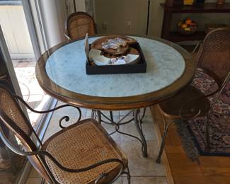 Marble Top with Wood Trim Table & 3 Cane Back Chairs.  Two of the Chairs require TLC or remove the Cane & replace with wood seats.  