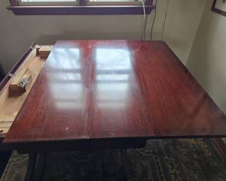 Dining room table - drop leaf sides and leaves.  5 chairs and table pads.