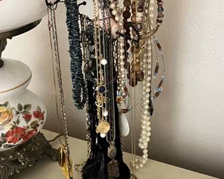 Assorted Costume Jewelry Collection on Black Metal Tiered Stand