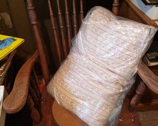 Antique rocker and feather pillow