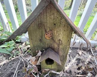 Rustic Wooden Birdhouse with Metal Roof and Ladybug Decoration