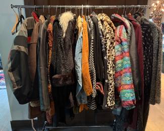 An array of winter jackets and sweaters