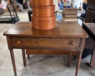 Shaker style wood boxes on oak desk 