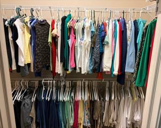 More closets filled with women's clothing and accessories.