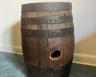 Small-scale antique wooden barrel with heavy iron straps and great rustic character