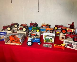 Staggering collection of Ertl farm tractors including Farmall and John Deere