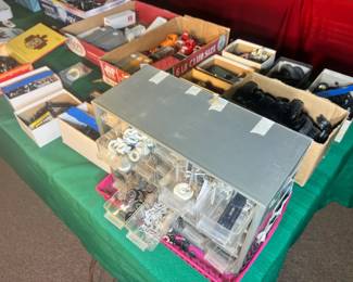 Multi-drawer parts organizer filled with vintage die-cast restoration components