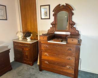 Exceptional Victorian-style marble-top dresser with a massive carved mirror and glove boxes
