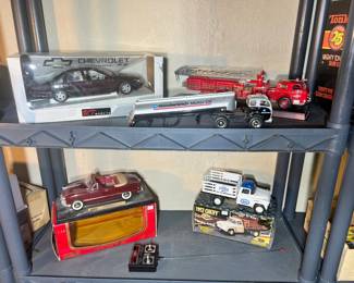 Shelving unit featuring a UT Models Chevy Impala SS and various emergency vehicles