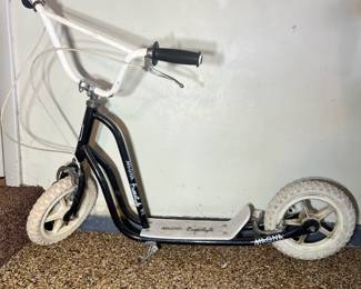 Magna Freestyle black and white scooter with rugged pneumatic tires