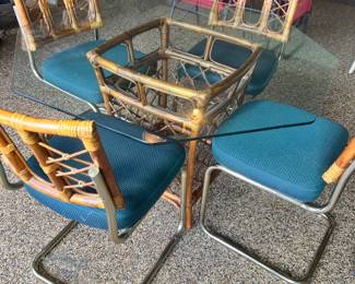 Mid-century modern bamboo and glass dining set with deep teal cushioned seats