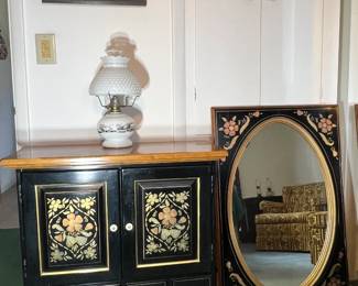 Exceptional Ethan Allen hand-painted black accent cabinet with gold floral motifs and coordinating wall mirror
