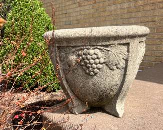 Heavy concrete garden planter featuring a raised grape and leaf design